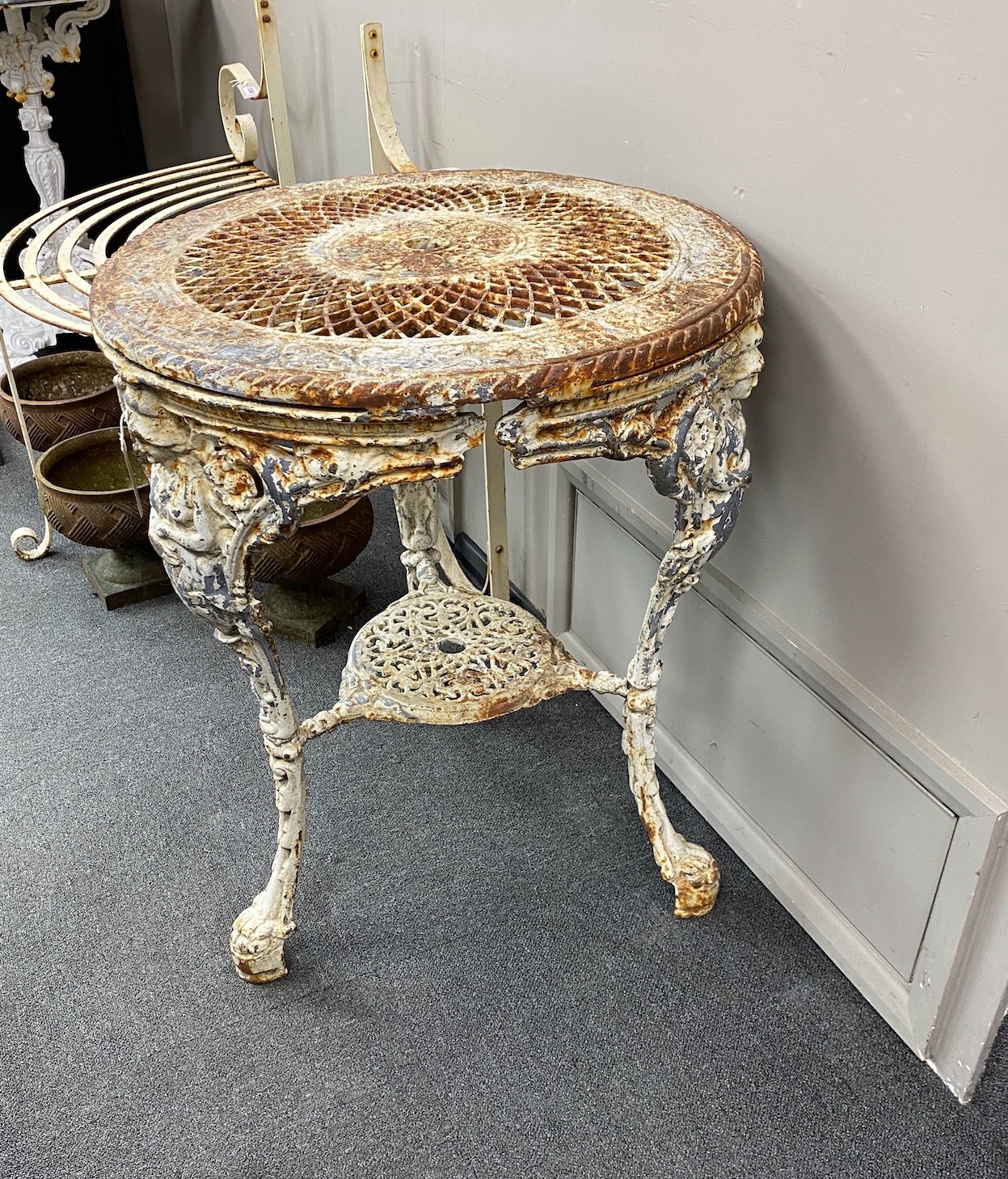 A Victorian painted cast iron circular Britannia table with pierced lattice work top, diameter 61cm, height 75cm